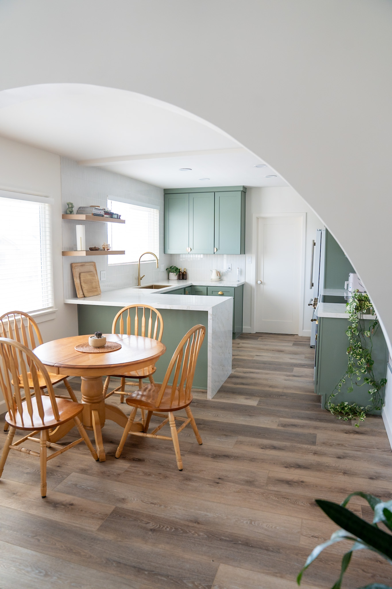 Hollywood kitchen remodel after — warm wood cabinetry and quartz countertops