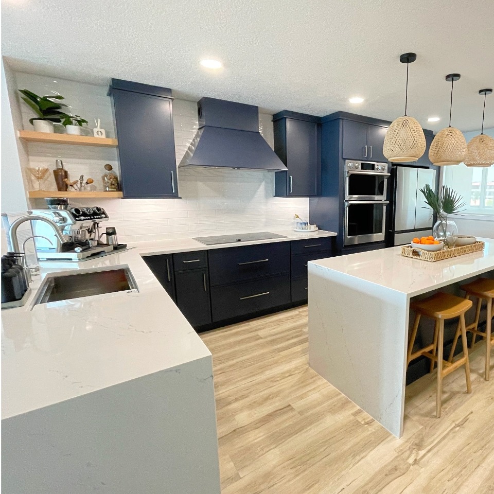 Santa Monica kitchen after remodel — bright white Shaker cabinets and quartz counters
