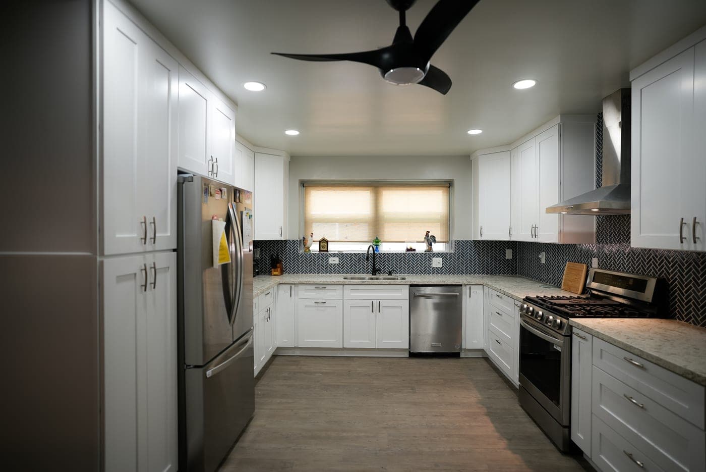 Wide view of the U-shaped North Hills kitchen with stainless appliances