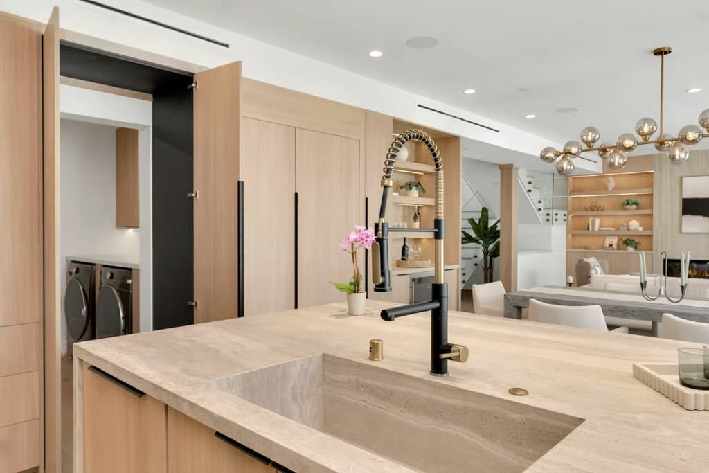 Close view of the integrated stone sink in the island